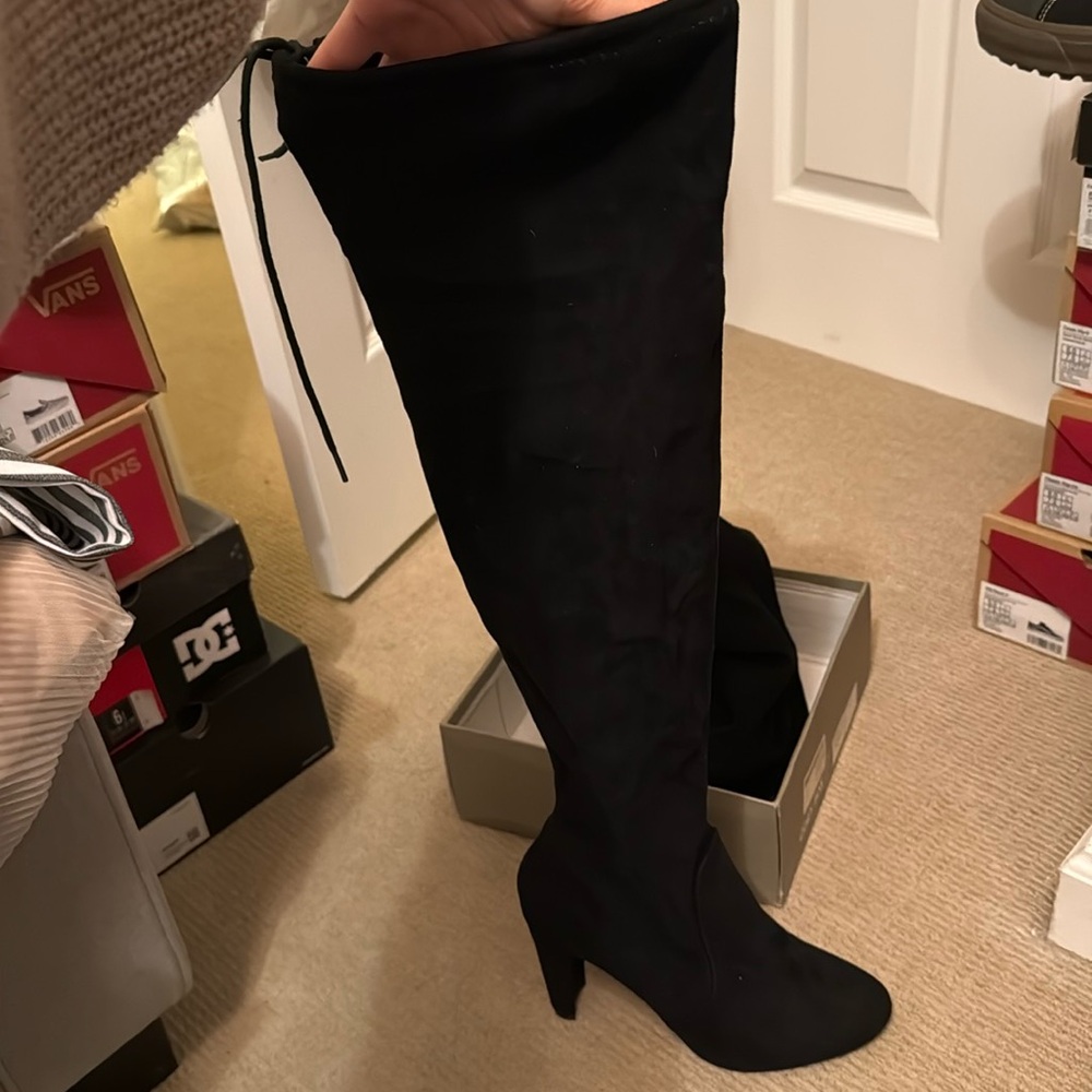 Thigh high heeled boots